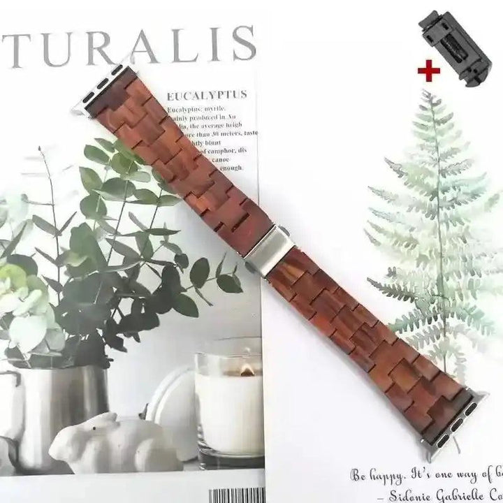 Handcrafted dark brown wooden Apple Watch band with silver clasp, shown with a link removal tool.