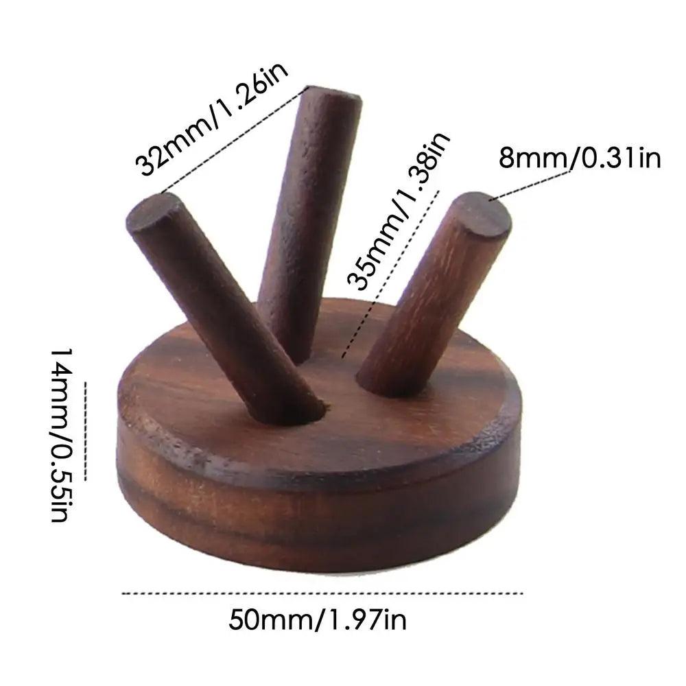 Small dark wood crystal display stand rack with three pegs, showing dimensions in mm and inches.