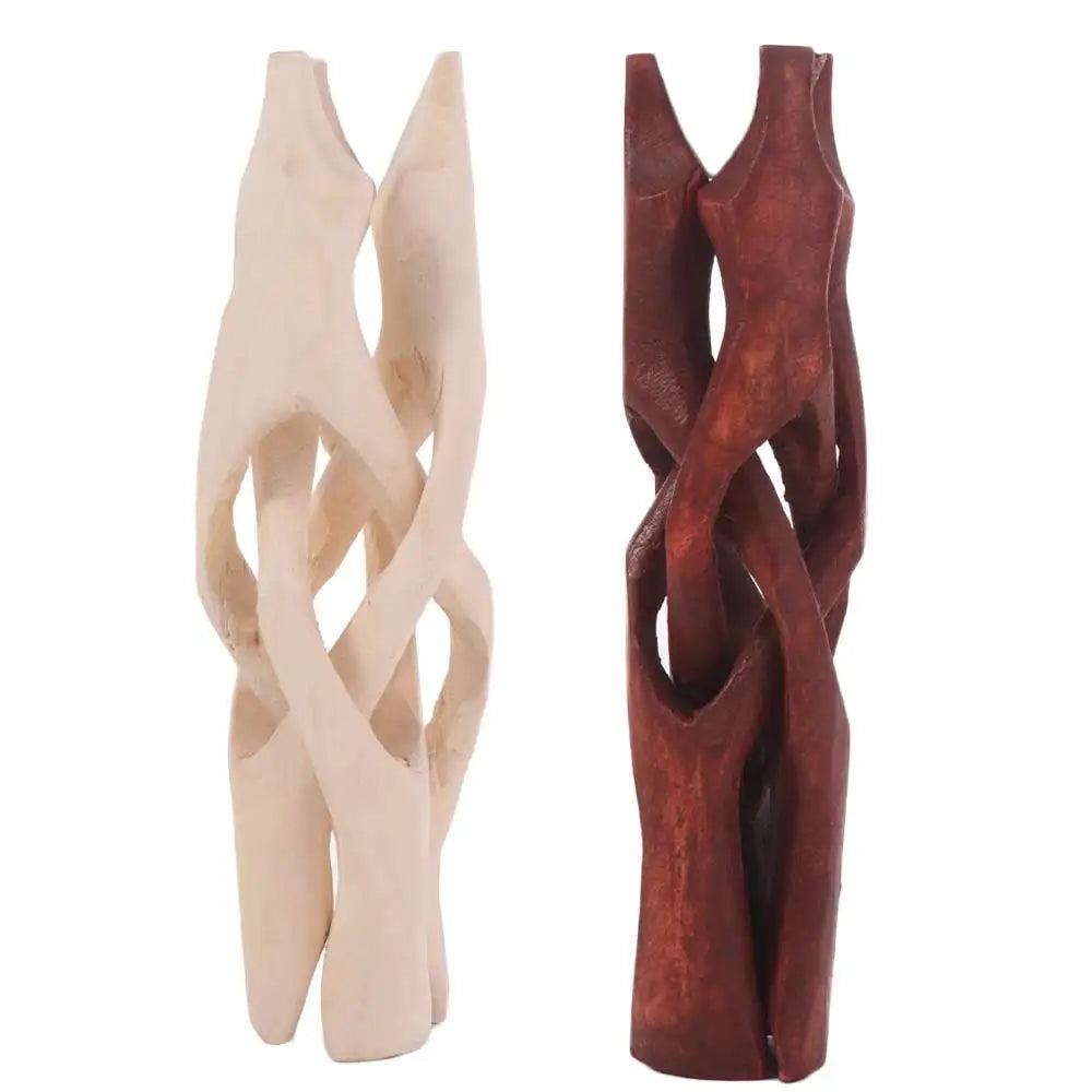 Two carved wooden tripod display stands, one light natural wood and one dark reddish-brown, for crystal spheres or shells.