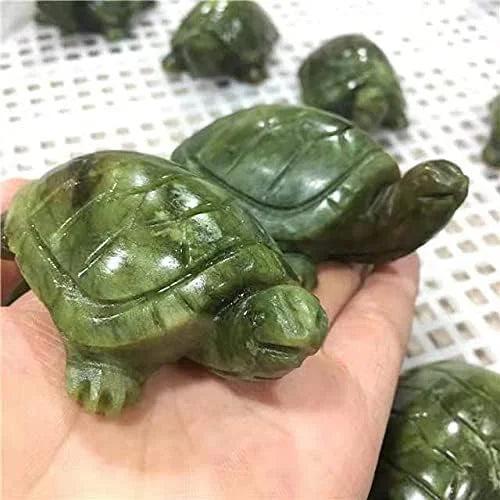 Hand-carved Xiuyan Jade turtle figurine, a polished green crystal sculpture for grounding and Heart Chakra healing.