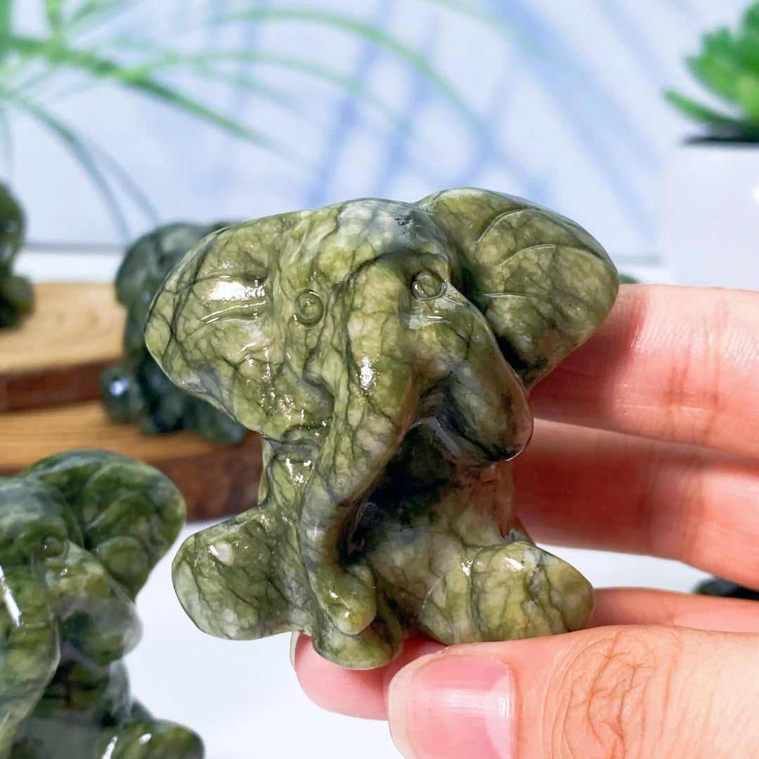 Xiuyan Jade Crystal Carved Elephant Statue, a powerful symbol of wisdom and protection, with deep waxy greens.