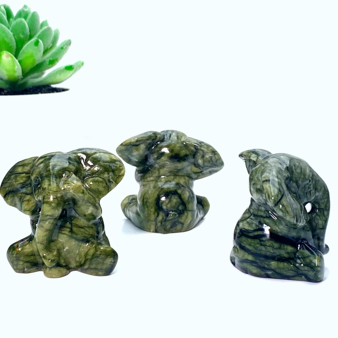 Three Xiuyan Jade Crystal Carved Elephant Statues, deep waxy green with veining, symbolizing luck and wisdom.