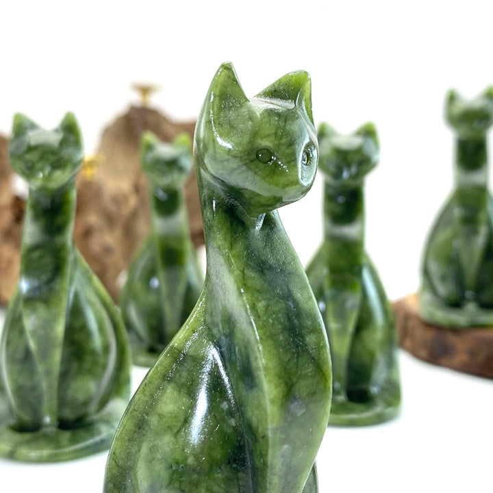 Polished green Xiuyan jade Egyptian cat carving, a natural crystal animal figurine for home decor or gifts.