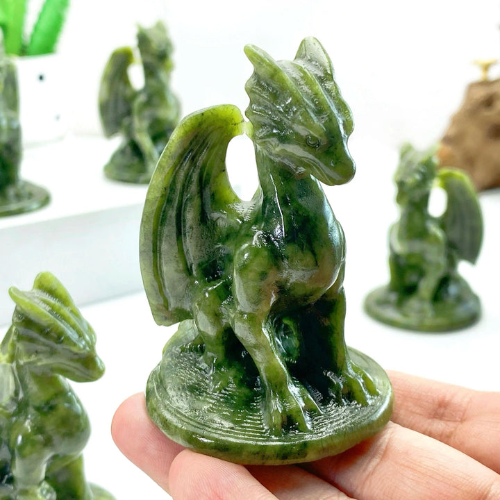 Hand-carved dark green Xiuyan Jade Pterosaur Dragon figurine, ideal for decor and healing.