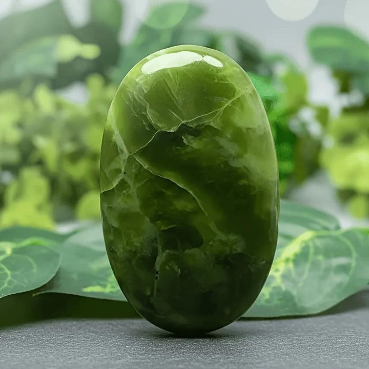 Polished green Xiuyu Palmstone crystal with natural veining for healing and boho decor.
