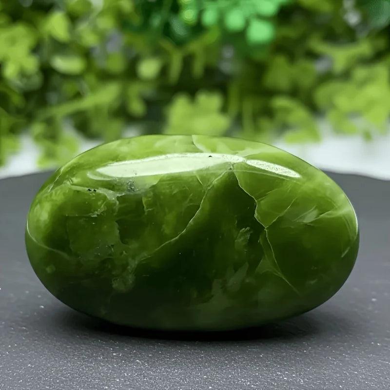 Polished green Xiuyu palmstone crystal, a soothing healing stone for bohemian home decor.
