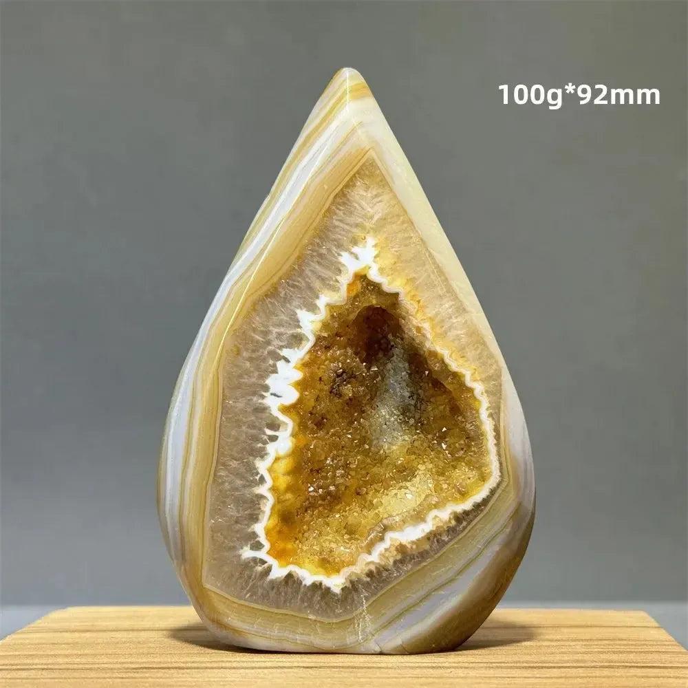 Yellow Agate Freeform Cave Torch from Crystal Destiny, a natural banded mineral specimen with a golden geode interior.