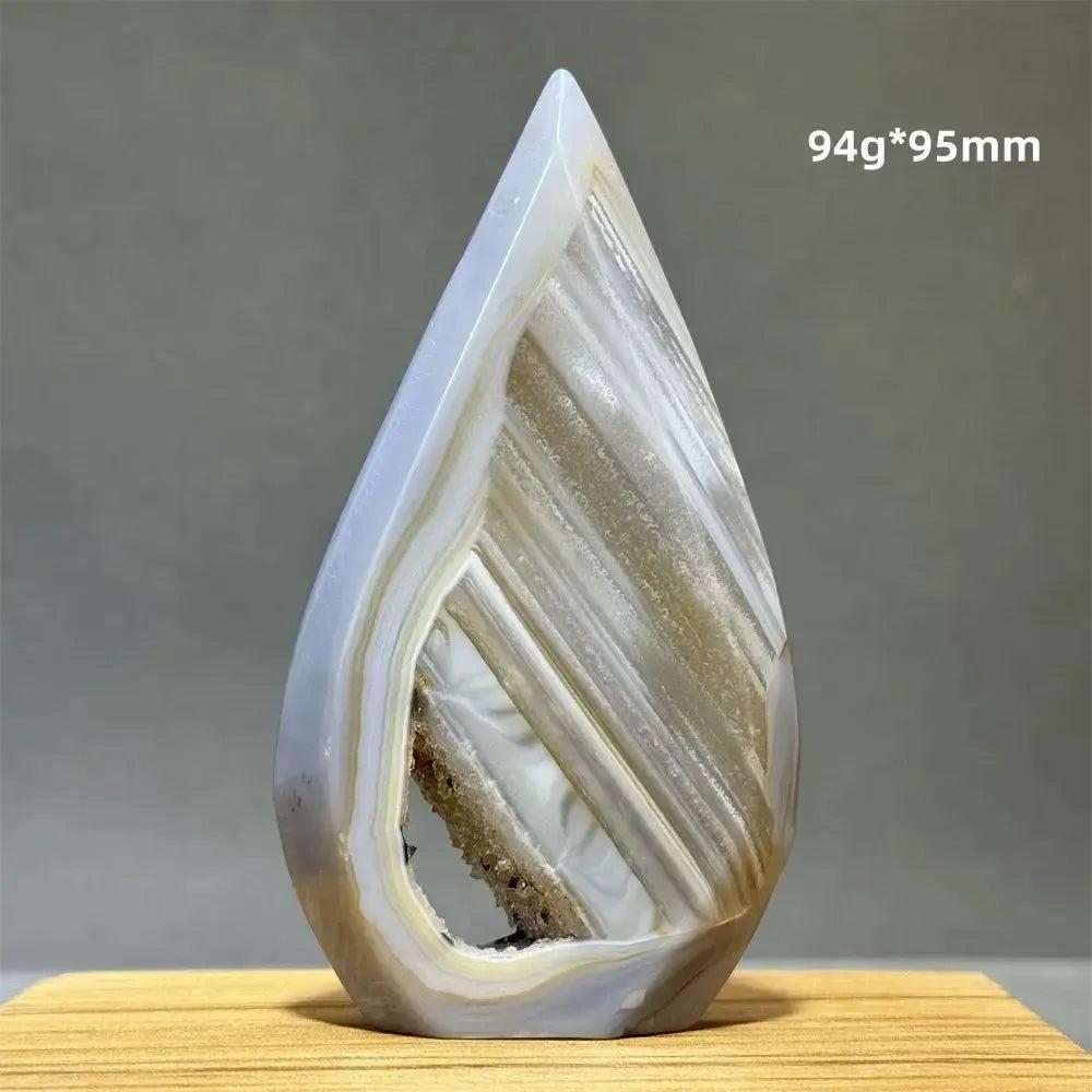 Crystal Destiny's banded agate freeform cave torch, a natural mineral specimen with a unique hollow.