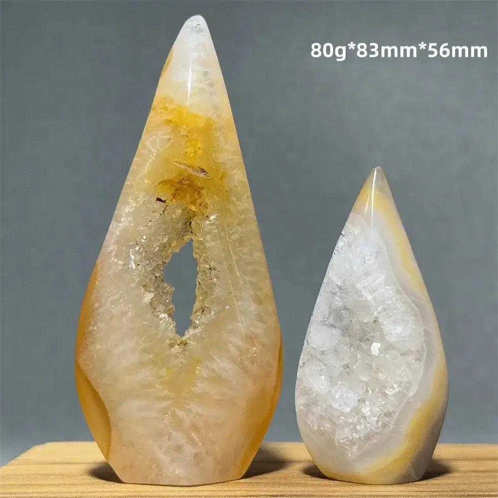 Two teardrop-shaped Yellow Agate freeform cave torches from Crystal Destiny, showcasing warm golden hues and sparkling geode interiors.