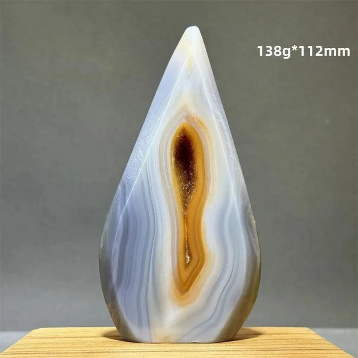 Teardrop-shaped Yellow Agate freeform cave torch from Crystal Destiny, with white, blue, and golden bands.