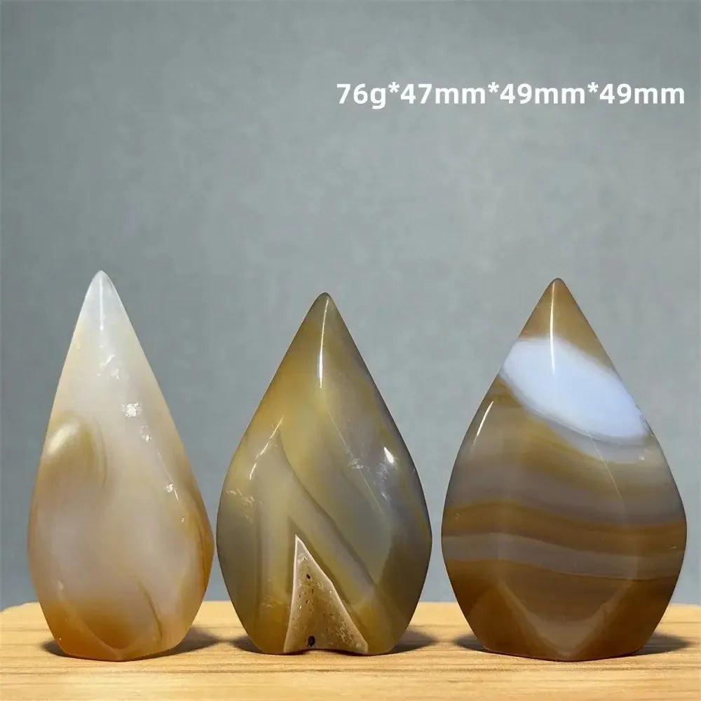 Three teardrop-shaped Yellow Agate freeform cave torches from Crystal Destiny, showcasing warm banded layers.