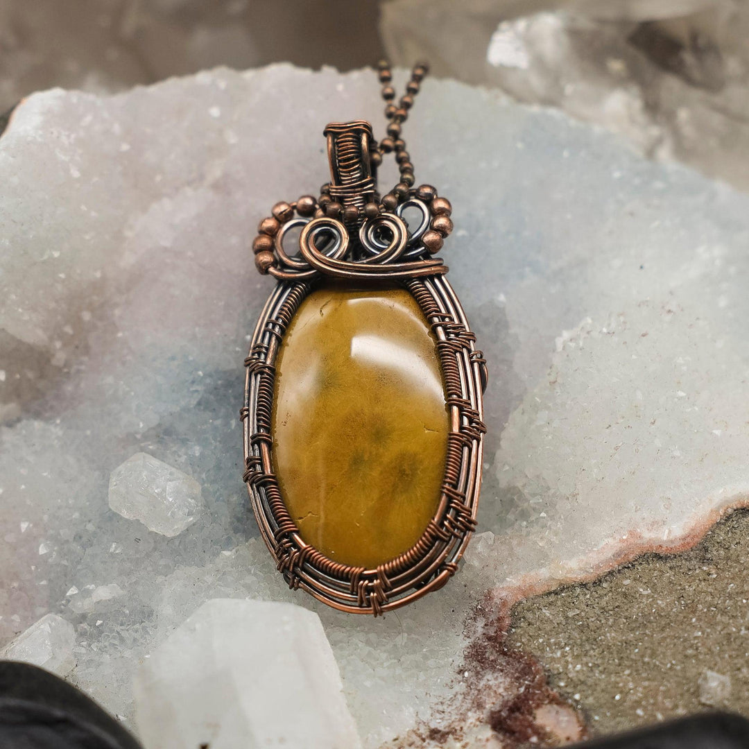 Pietersite Wire Wrap Pendant, 3-inch, handcrafted copper with swirling gold, blue, grey, and red chatoyant stone.