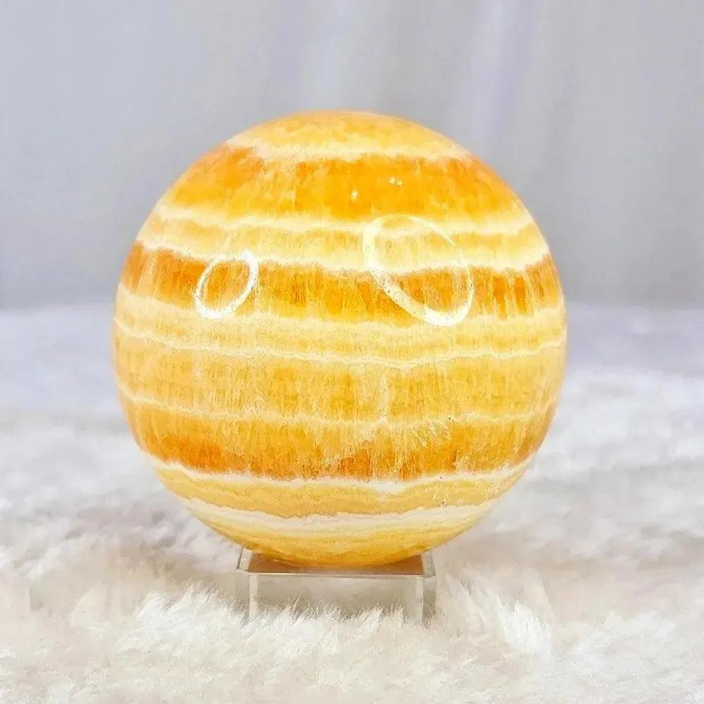 Polished Yellow Calcite Honey Calcite Sphere radiating warm honey-golden tones with natural banding, boosting confidence.