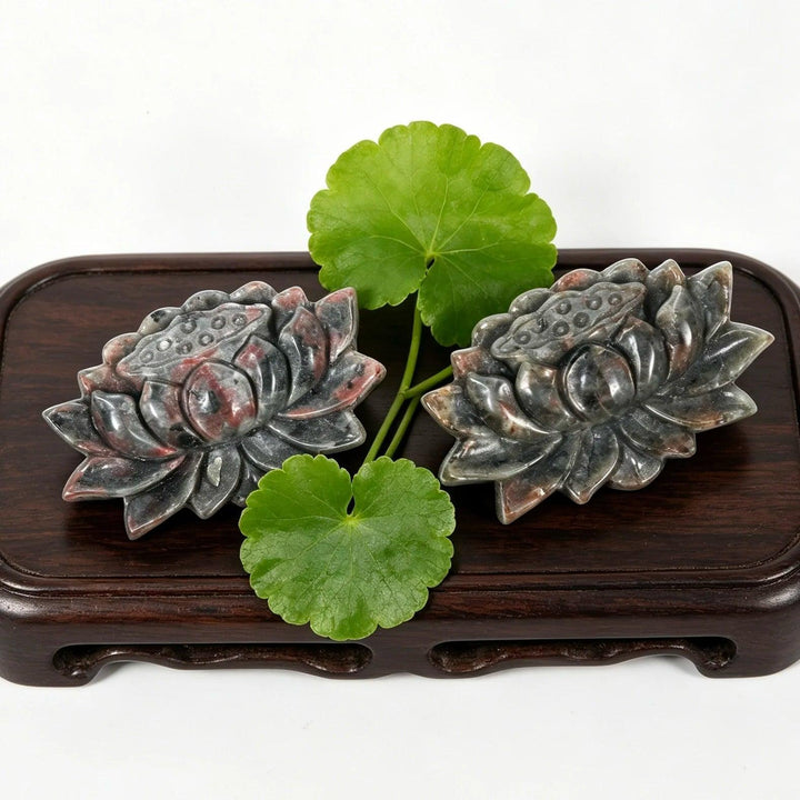 Yooperlite Crystal Carved Lotus Flower Statues, detailed grey stone with red veins, symbolizing peace and tranquility.