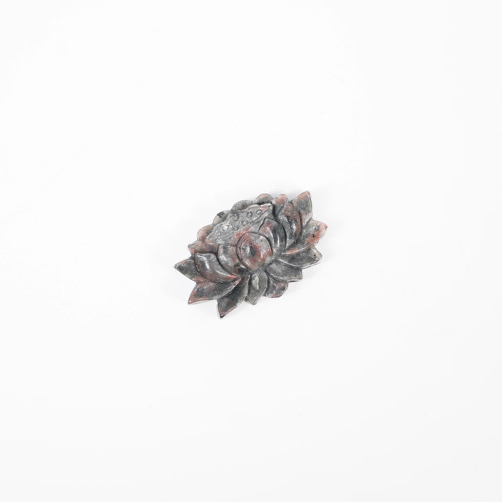 Yooperlite Crystal Carved Lotus Flower Statue Sculpture, a detailed grey stone carving for peace and tranquility.
