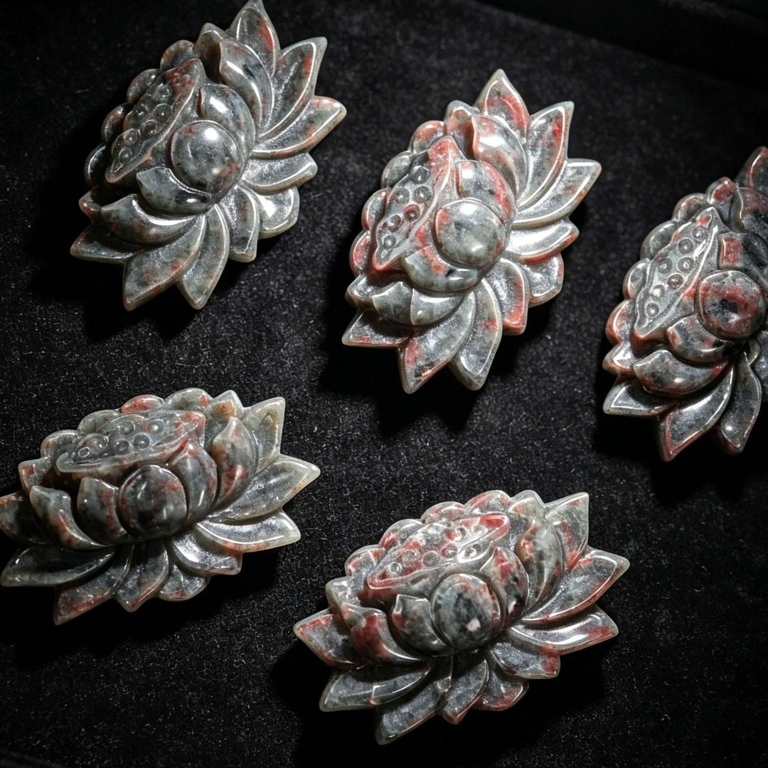 Yooperlite Crystal Carved Lotus Flower Statue Sculpture: Detailed grey stone with red accents, symbolizing peace and tranquility.