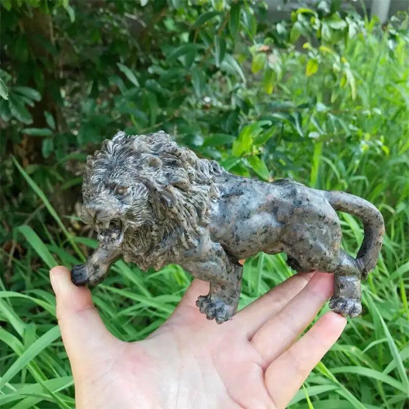 Hand-carved Yooperlite lion statue with a polished grey-green finish, perfect for Solar Plexus and Third Eye chakra work.