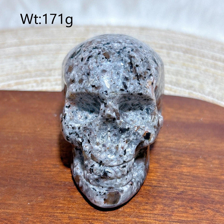 Yooperlite Crystal Carved Skull, a detailed grey stone with black flecks, weighing 171g, for protection and grounding.