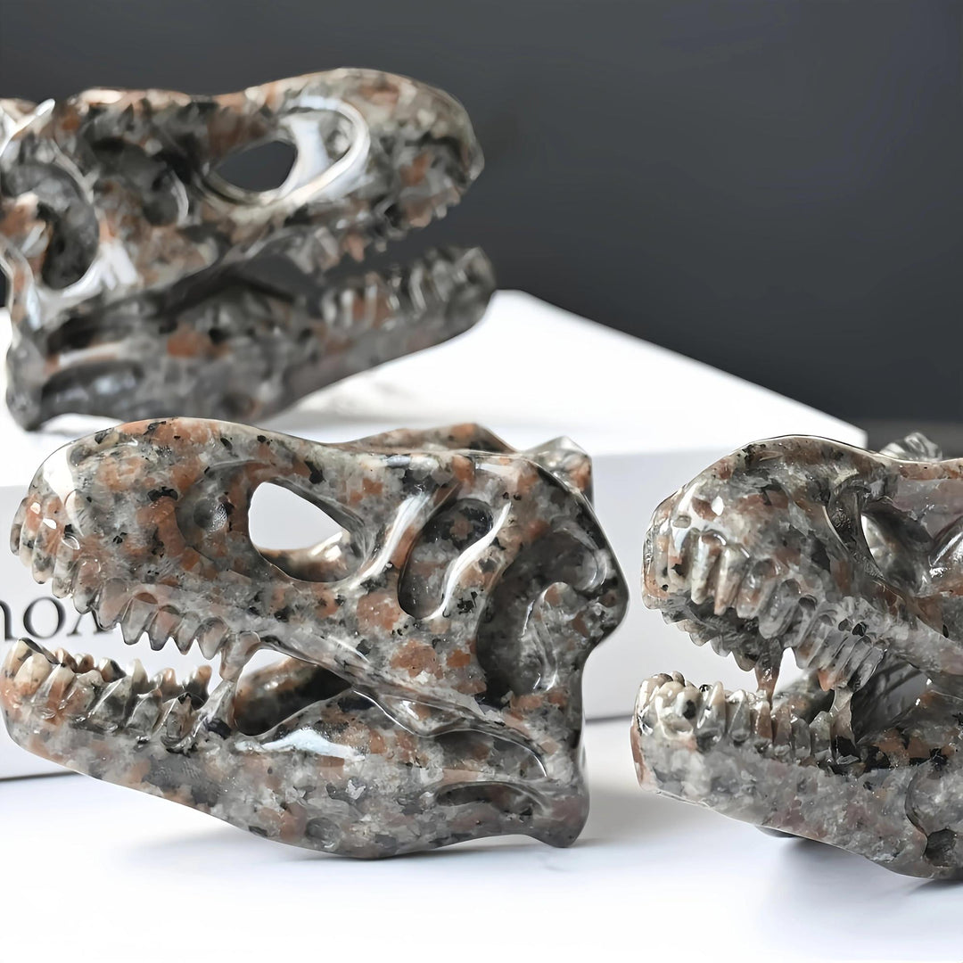 Yooperlite T-Rex skull carving, brown and gray with orange flecks, UV reactive, for protection and grounding.