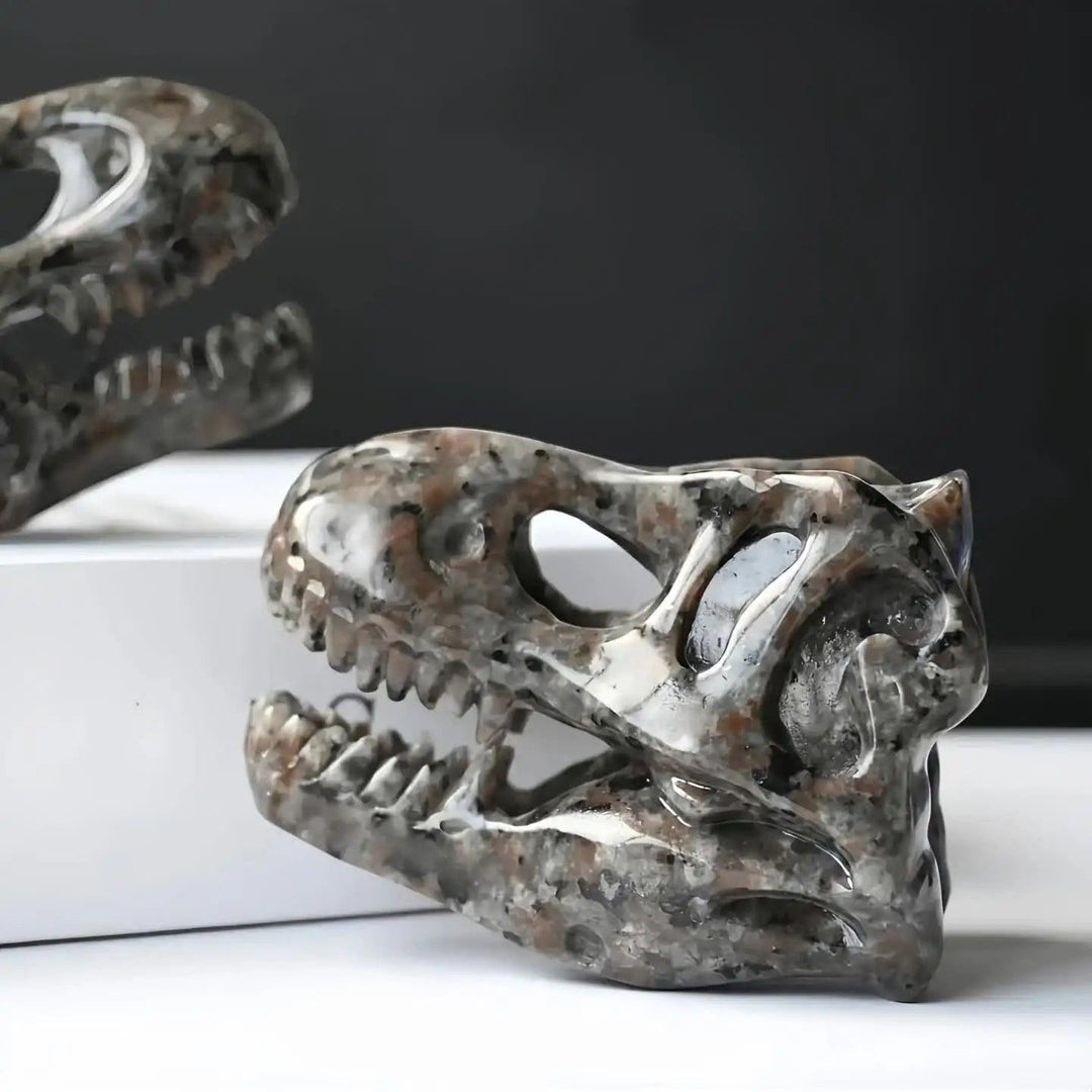 Yooperlite T-Rex skull carving, warm brown and gray, UV reactive, for protection and grounding.