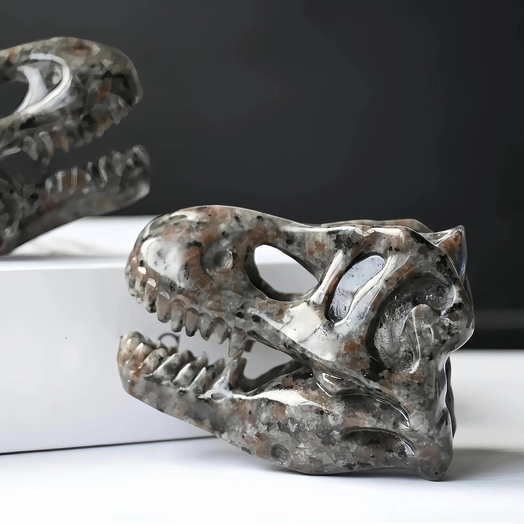 Yooperlite T-Rex skull carving, warm brown and gray, UV reactive, for protection and grounding.