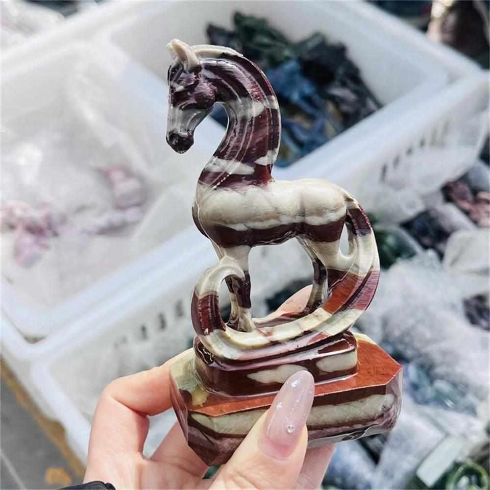 Hand-carved Zebra Stone horse sculpture featuring bold, grounding black and white stripes in a fluid, elegant design.