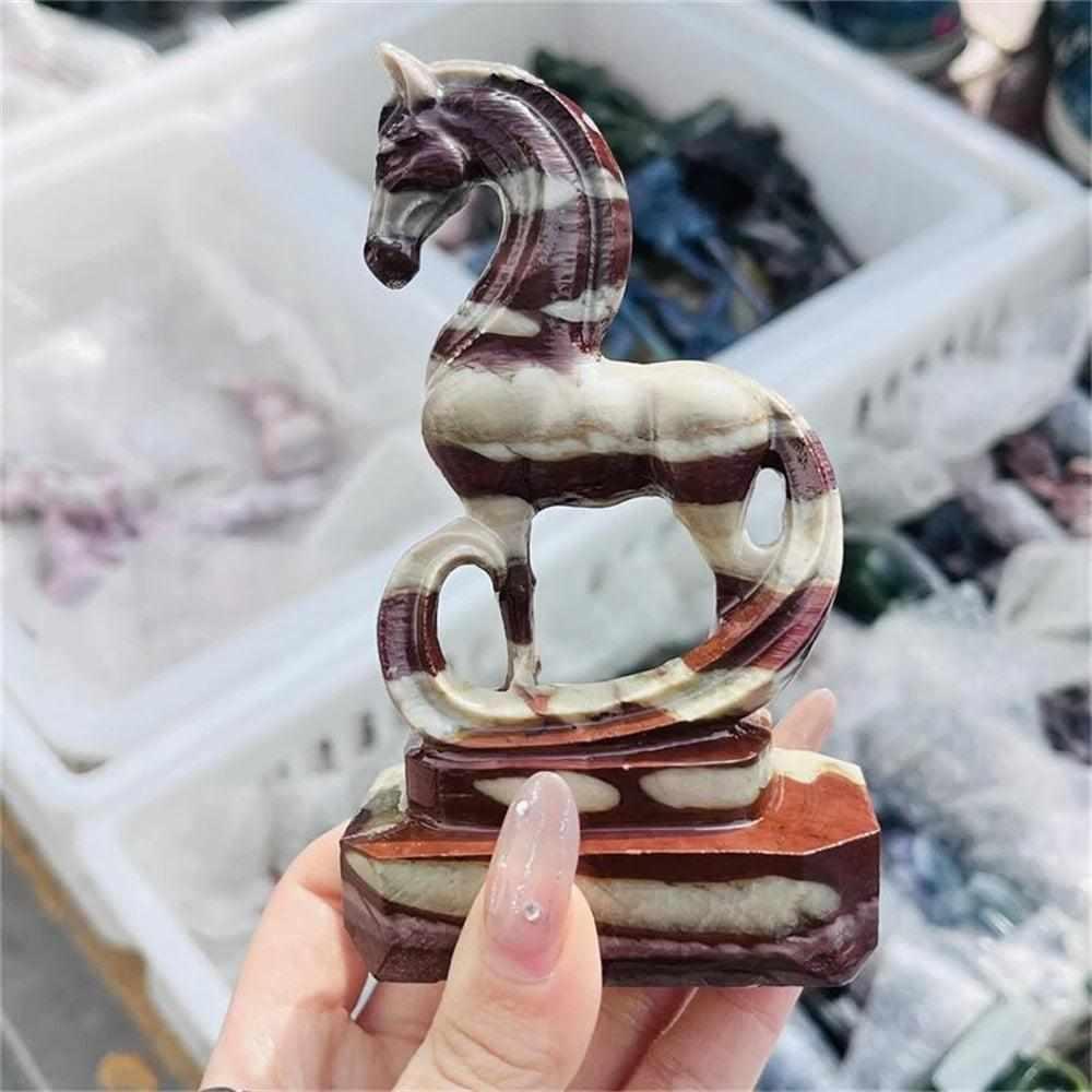 Hand-carved Zebra Stone horse sculpture featuring bold black and cream stripes for grounding Root Chakra energy.