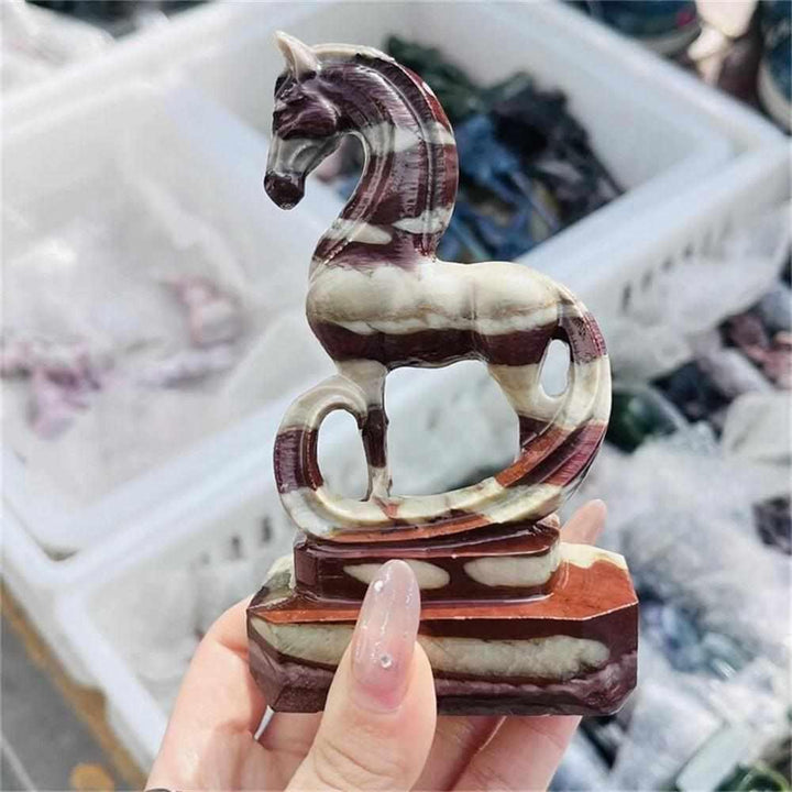 Hand-carved Zebra Stone horse sculpture featuring bold black and cream stripes for grounding Root Chakra energy.