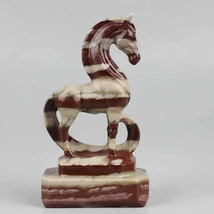 Hand-carved Zebra Stone horse sculpture featuring bold, grounding black and white stripes in a fluid, elegant design.