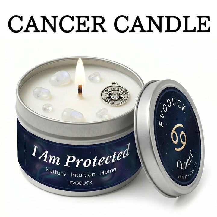 Cancer Crystal Infused Candle: White Tea & Sage tin with moonstone, a lit wick, and a silver crab charm.