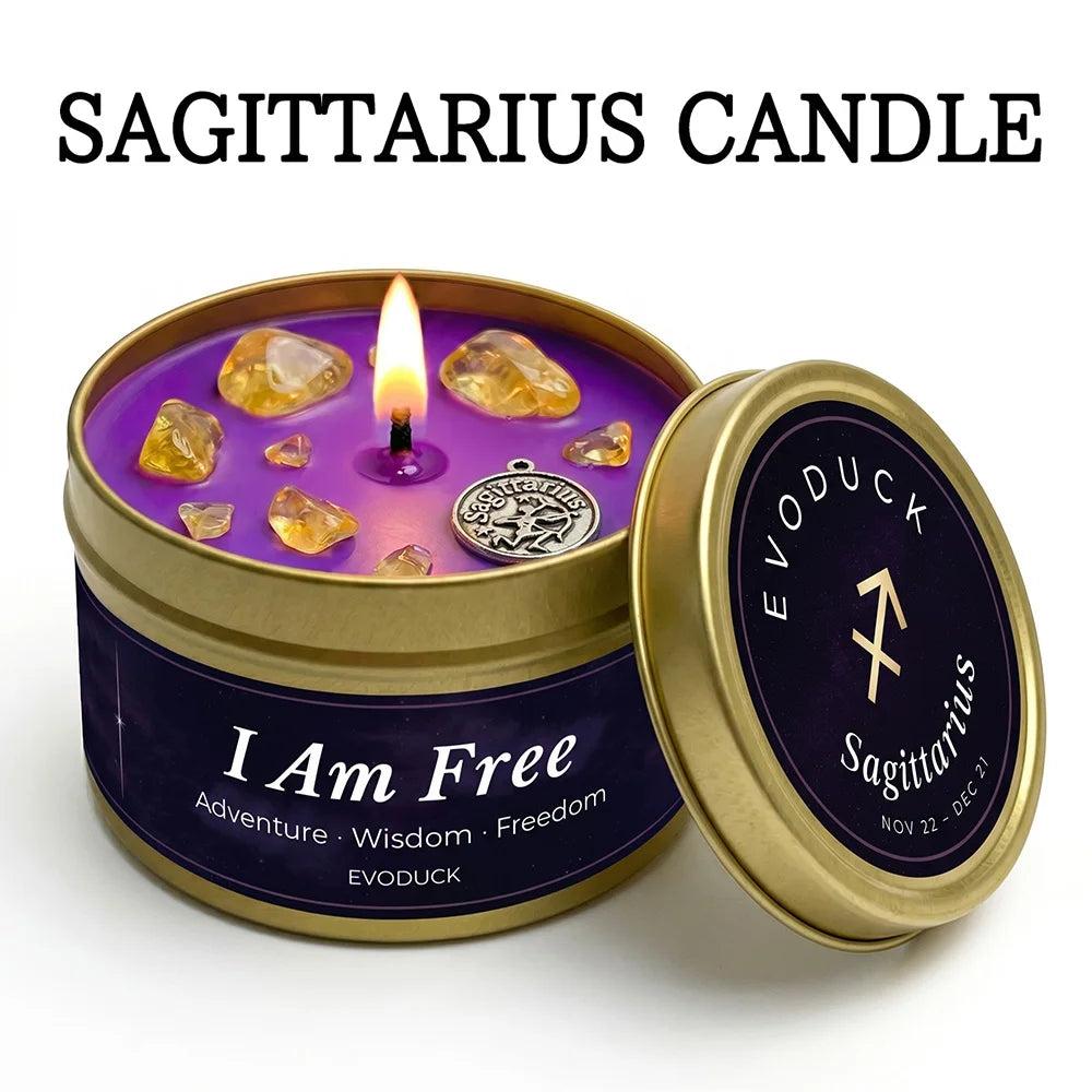 Sagittarius Zodiac Crystal Infused Candle with Citrine, a purple White Tea & Sage tin candle with a silver charm.