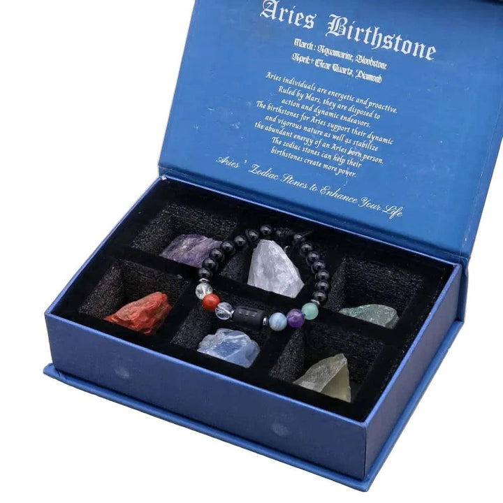 Aries Zodiac Crystals & Bracelet gift set with a black beaded bracelet and raw healing stones in a blue velvet-lined box.