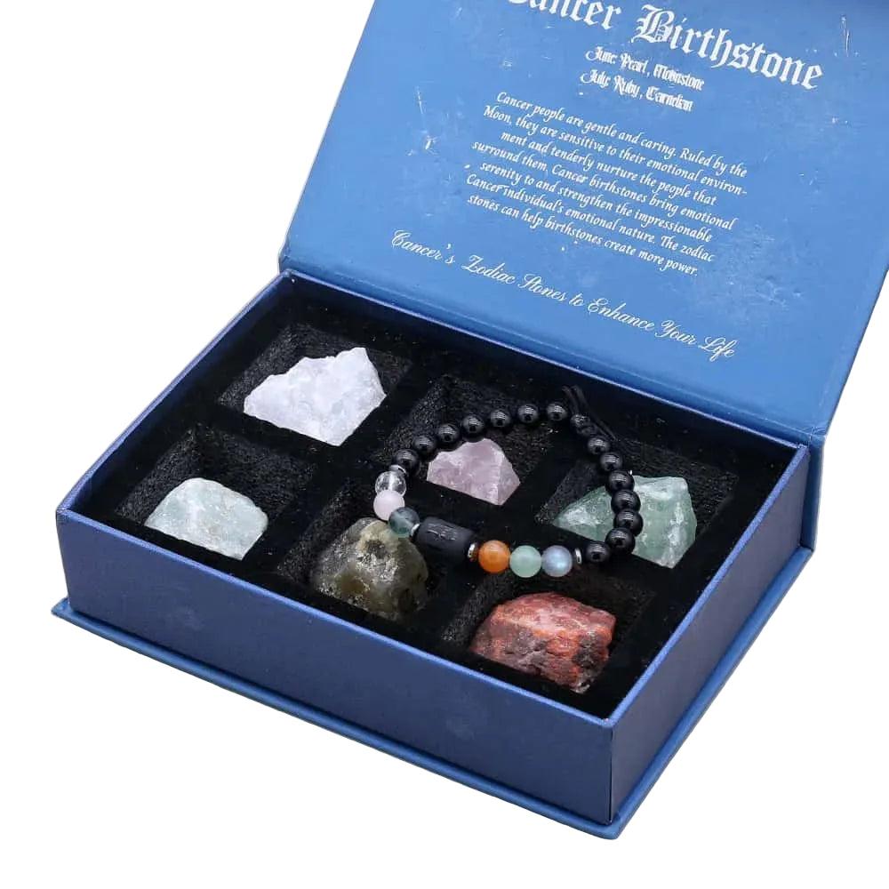 Velvet-lined Zodiac Crystals & Bracelet gift box with Lapis Lazuli, Amethyst, and raw stone accents.