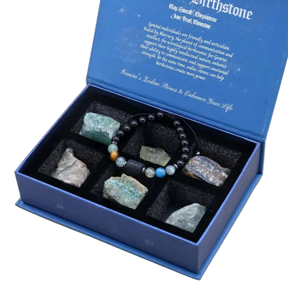 Blue velvet-lined Zodiac Crystals & Bracelet gift box with black beaded bracelet and raw Lapis Lazuli and Amethyst stones.