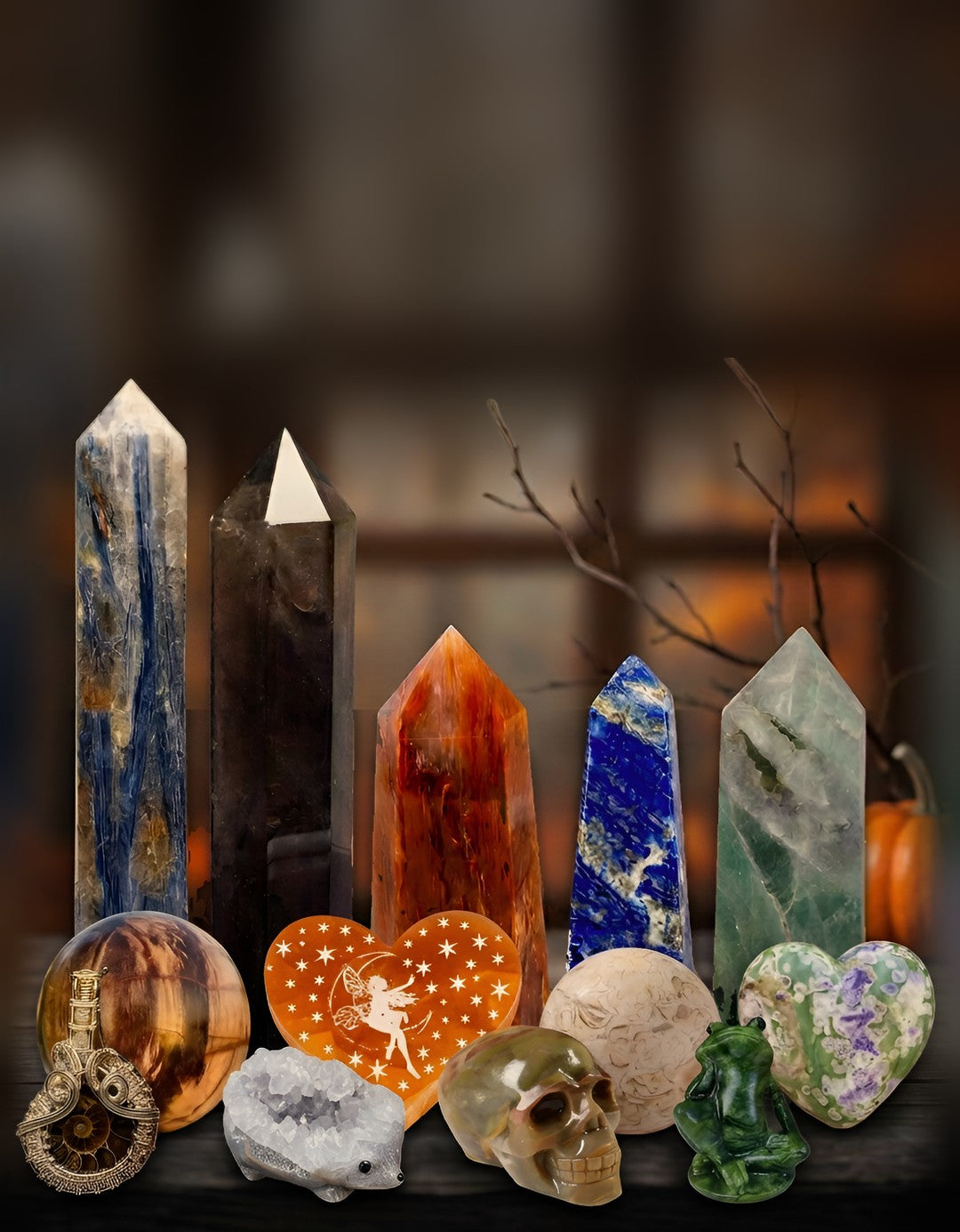 Crystal towers, hearts and novelty carvings on a rustic wood shelf in autumn light for the October 25% off sale